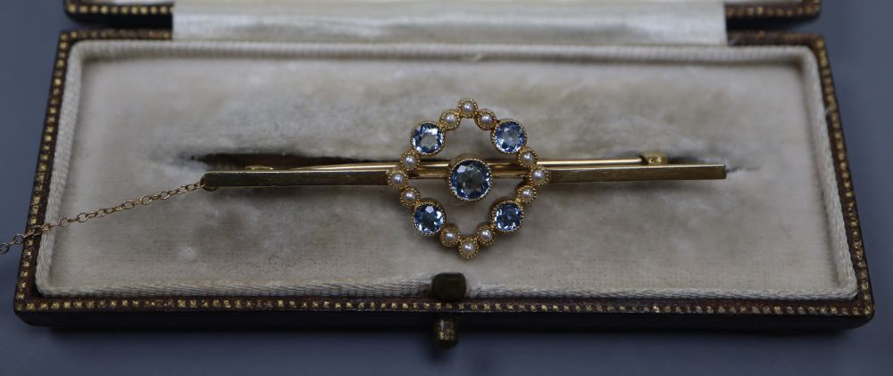 A 1920s 15ct, aquamarine and seed pearl set bar brooch, 57m, gross 4.5 grams.